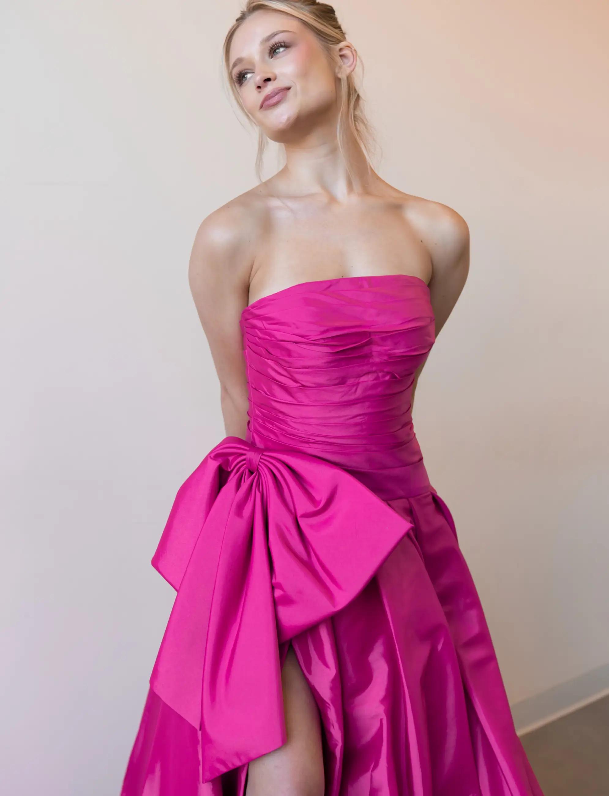 Model wearing pink prom dress