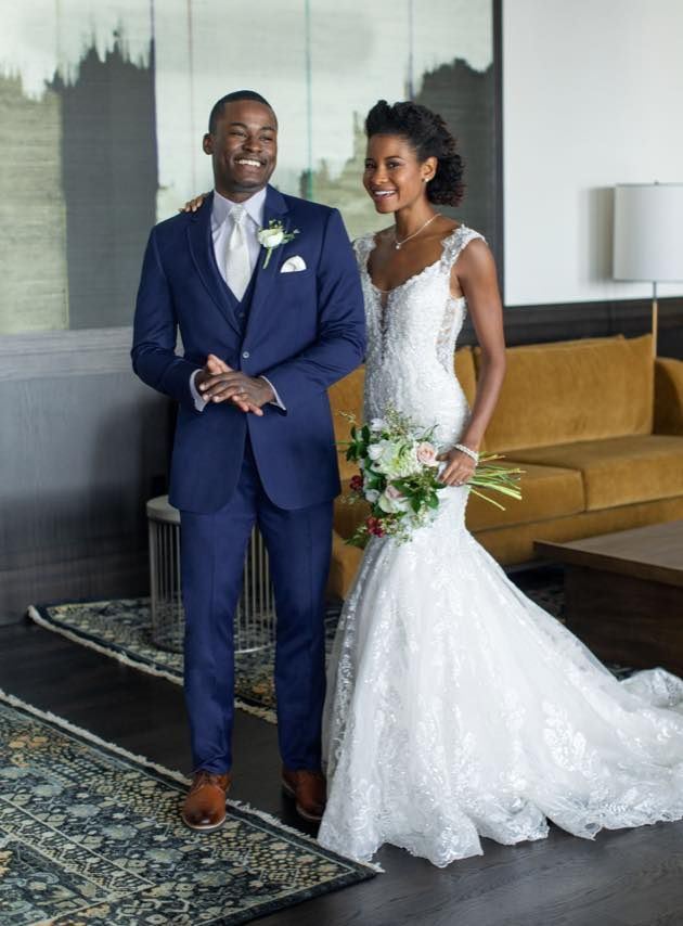 Bride and groom in navy tuxedo and white dress