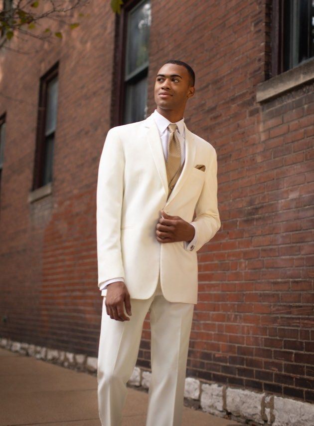 Groom in off white tuxedo